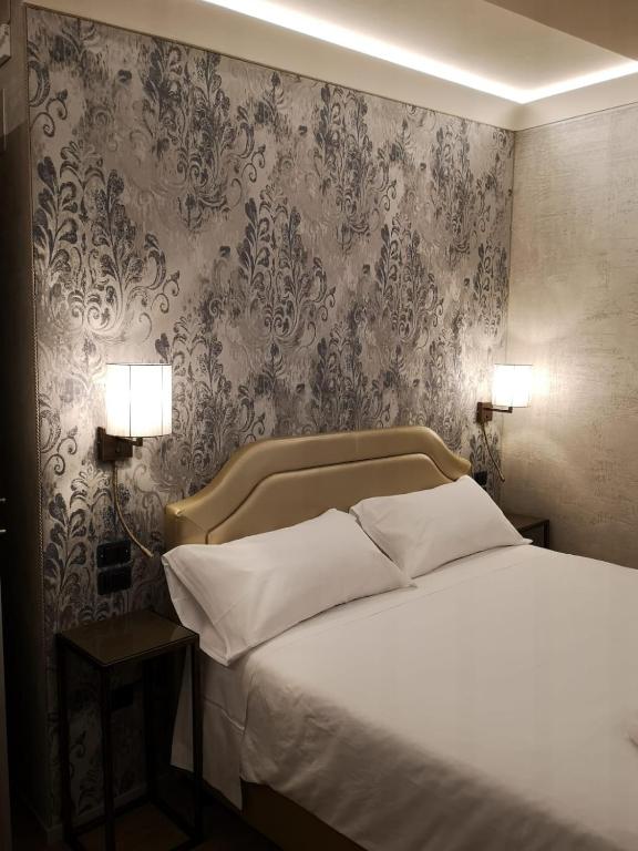Postel nebo postele na pokoji v ubytování Locanda Cavanella