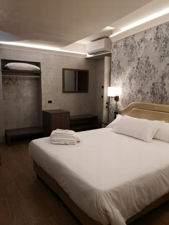 Postel nebo postele na pokoji v ubytování Locanda Cavanella