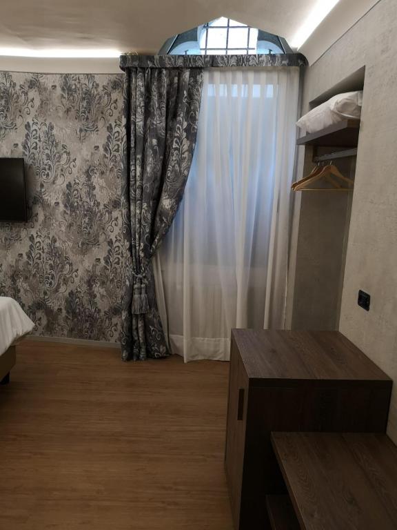 Postel nebo postele na pokoji v ubytování Locanda Cavanella