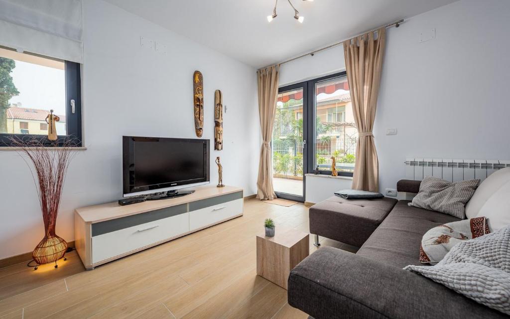 Telewizja i/lub zestaw kina domowego w obiekcie PUNTA MARY house with apartment