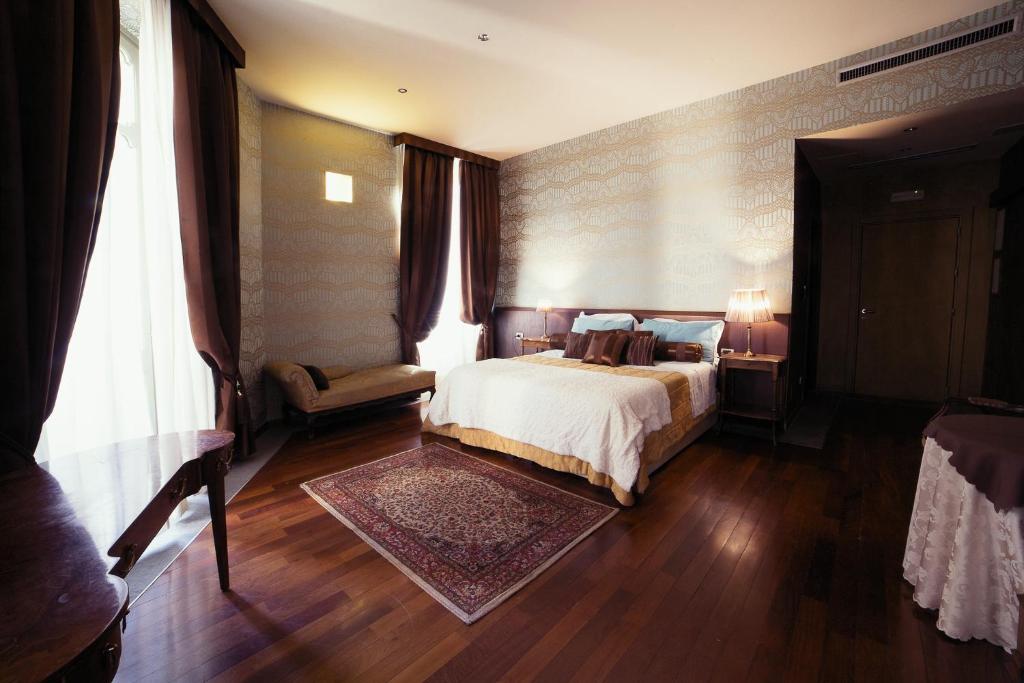 Кровать или кровати в номере Hotel Dei Pittori