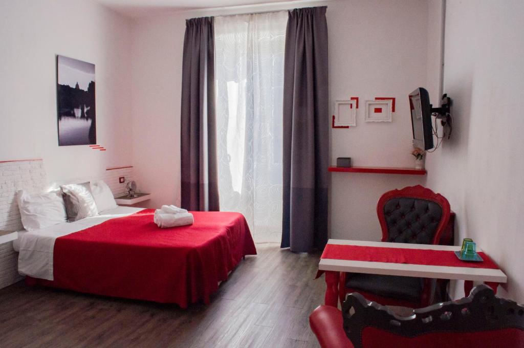 Posteľ alebo postele v izbe v ubytovaní Relais Cola Di Rienzo