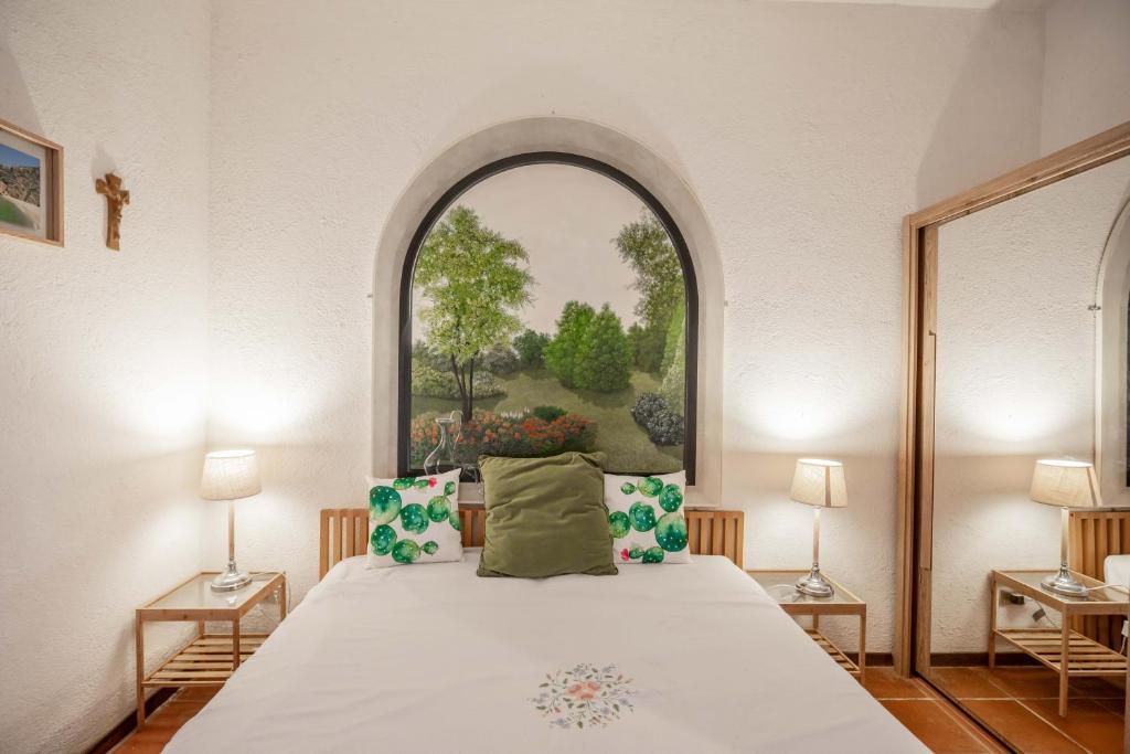 Postel nebo postele na pokoji v ubytování Smeralda