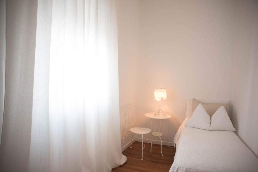 Łóżko lub łóżka w pokoju w obiekcie IF House
