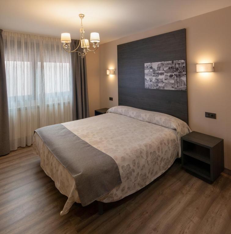 Postel nebo postele na pokoji v ubytování Hotel Las Cancelas
