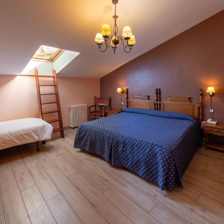 Postel nebo postele na pokoji v ubytování Hotel Las Cancelas