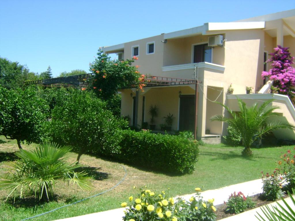 a view of a house with bushes and trees at Niki Apartments in Ulcinj