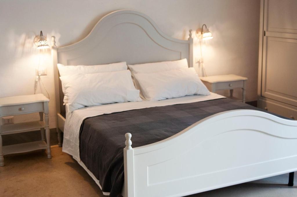 Posteľ alebo postele v izbe v ubytovaní Le Finestre Su Porta Carrese - Luxury Rooms