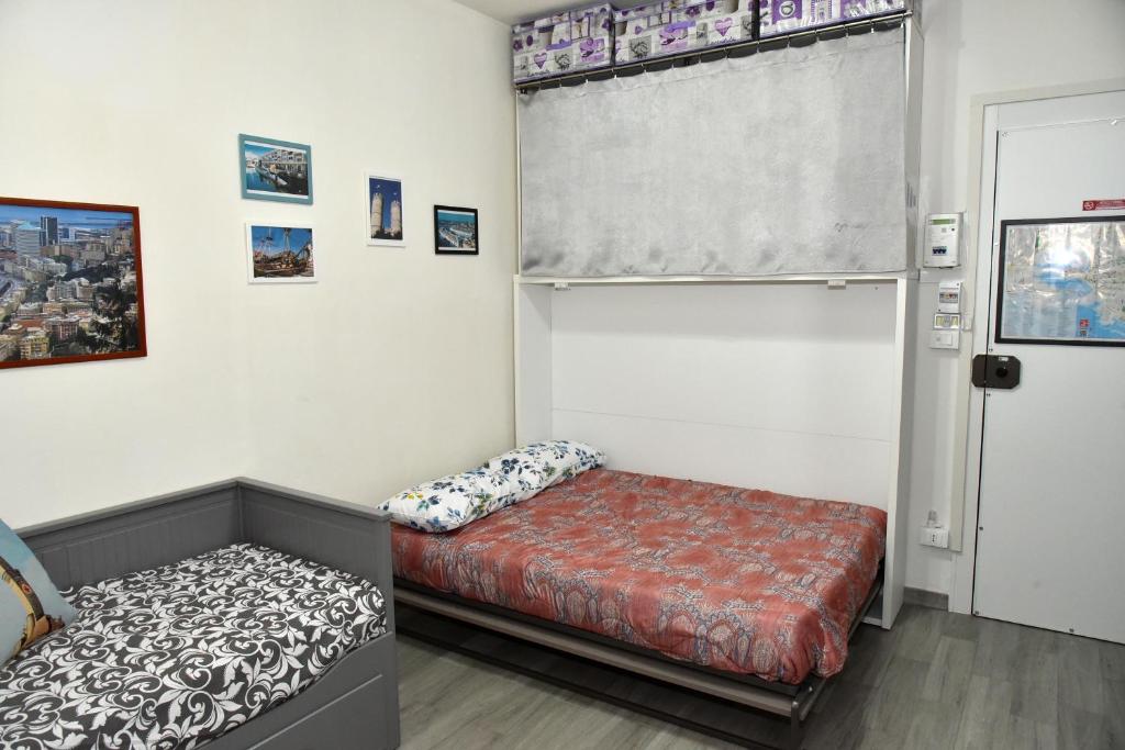 A bed or beds in a room at Diana Guest House