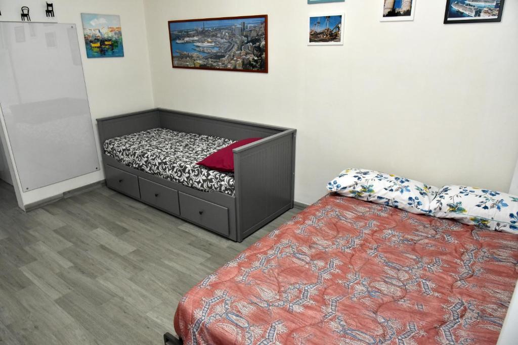 A bed or beds in a room at Diana Guest House