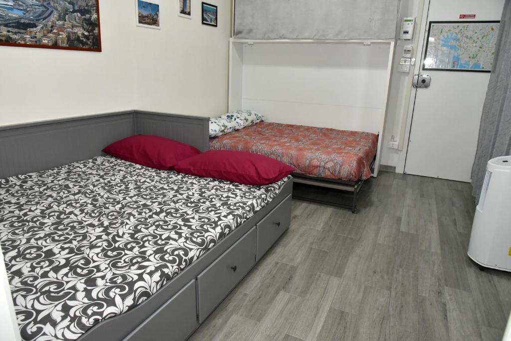 A bed or beds in a room at Diana Guest House