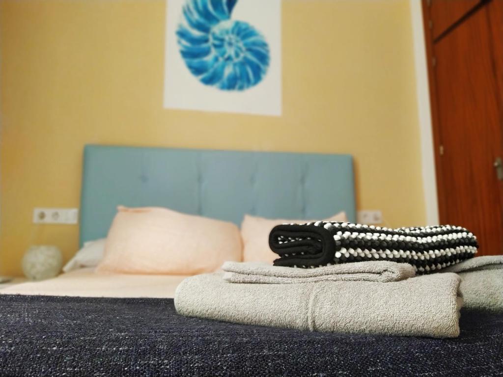 Posteľ alebo postele v izbe v ubytovaní Hostal Casa Nautilus