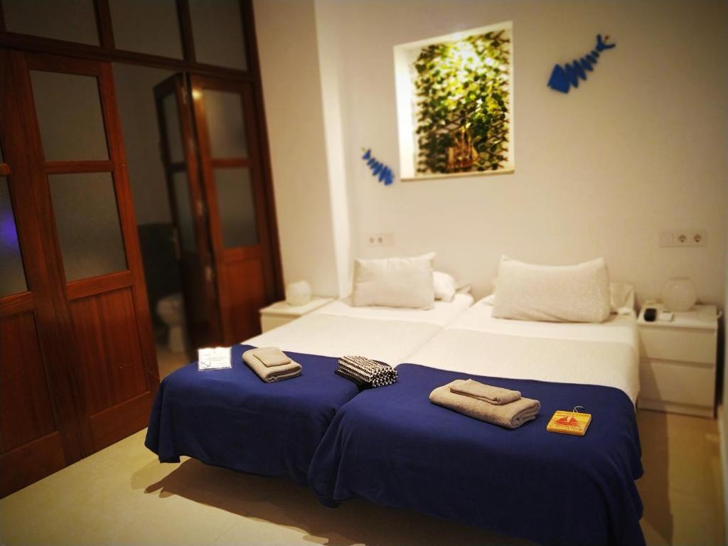 Posteľ alebo postele v izbe v ubytovaní Hostal Casa Nautilus