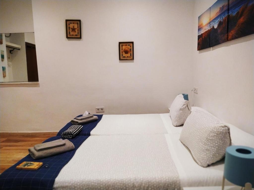 Posteľ alebo postele v izbe v ubytovaní Hostal Casa Nautilus