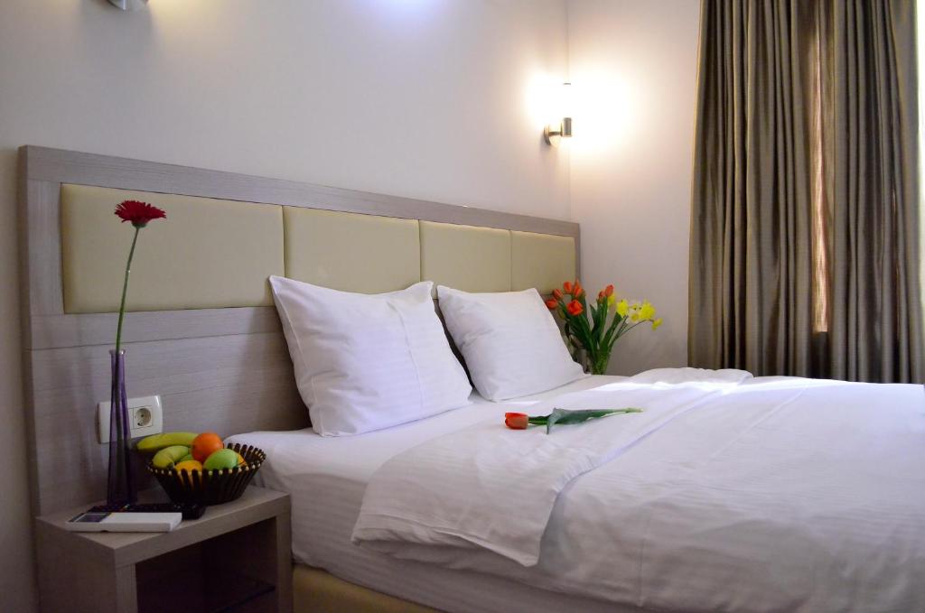 Postel nebo postele na pokoji v ubytování Hotel Vlaho