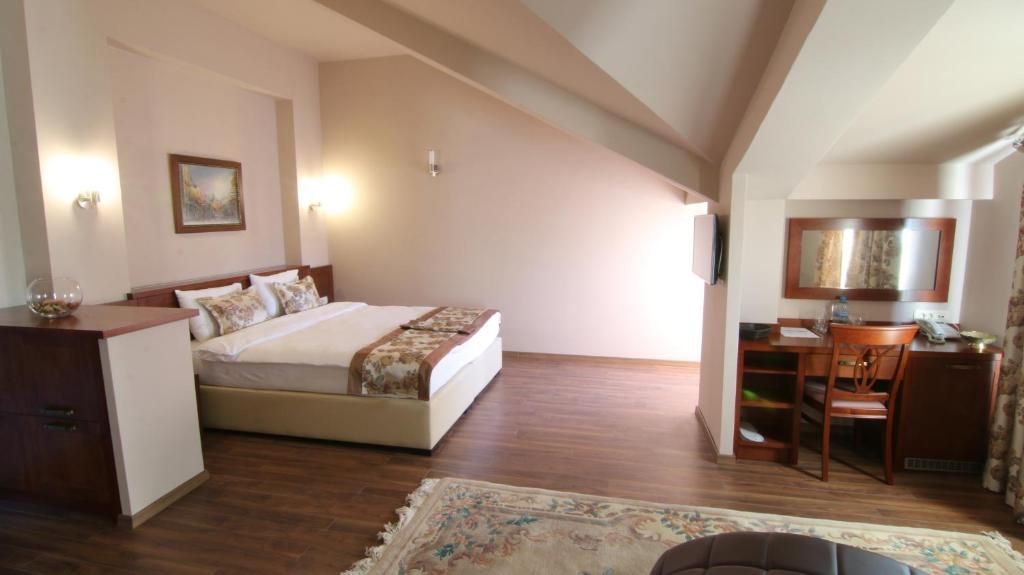 Postel nebo postele na pokoji v ubytování Hotel Vlaho