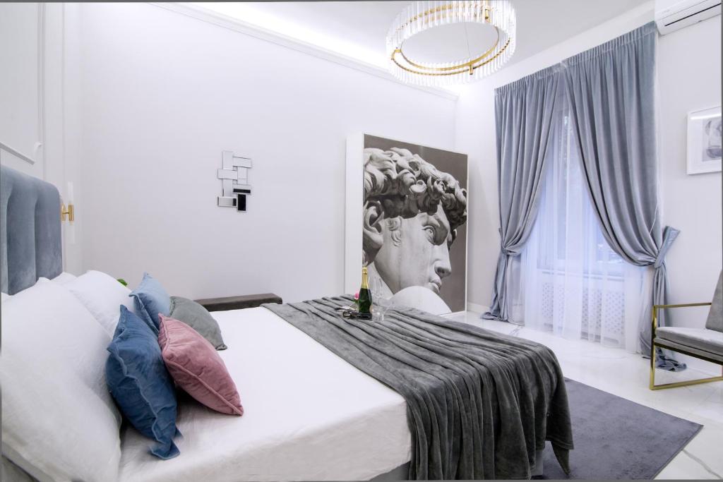 Łóżko lub łóżka w pokoju w obiekcie Roma Deluxe Apartments