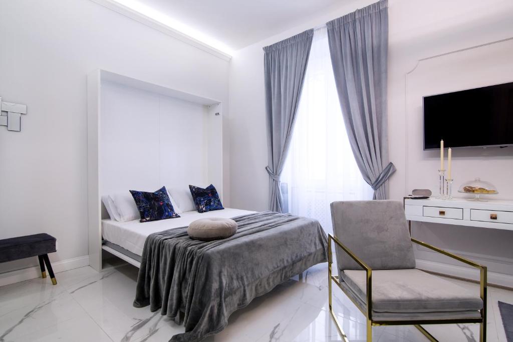 Łóżko lub łóżka w pokoju w obiekcie Roma Deluxe Apartments