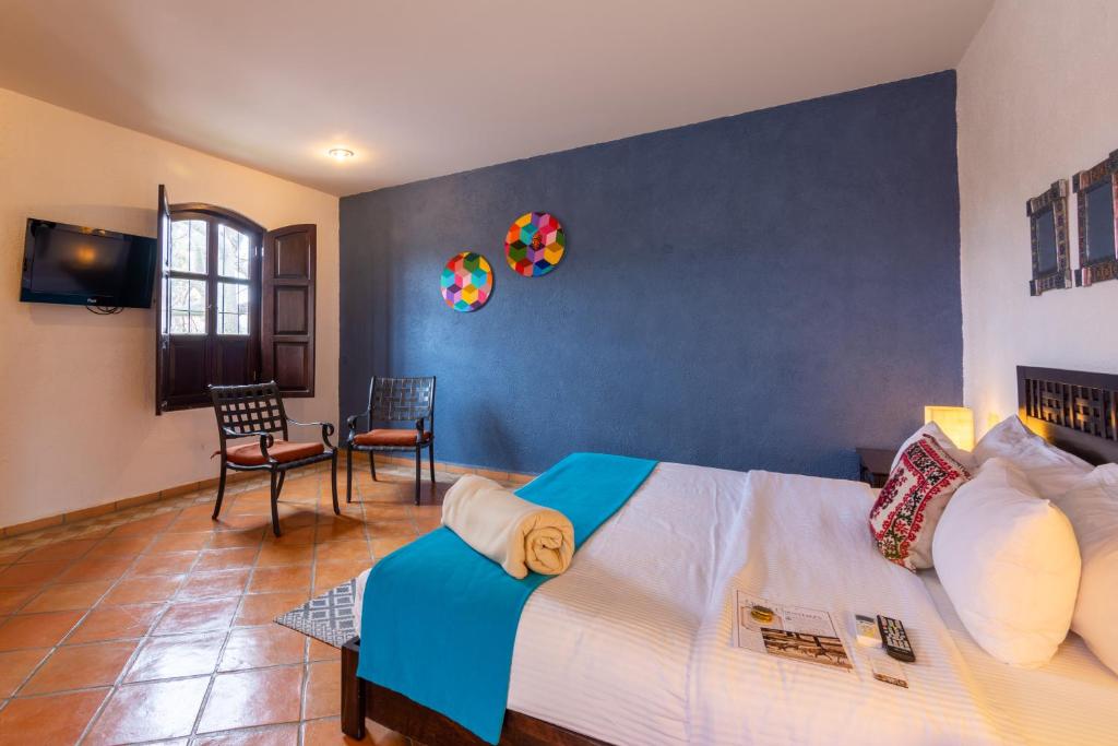 TV a/nebo společenská místnost v ubytování Hotel Hacienda San Cristóbal