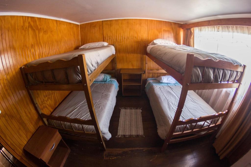 Uma cama ou camas num quarto em Hostal Helios