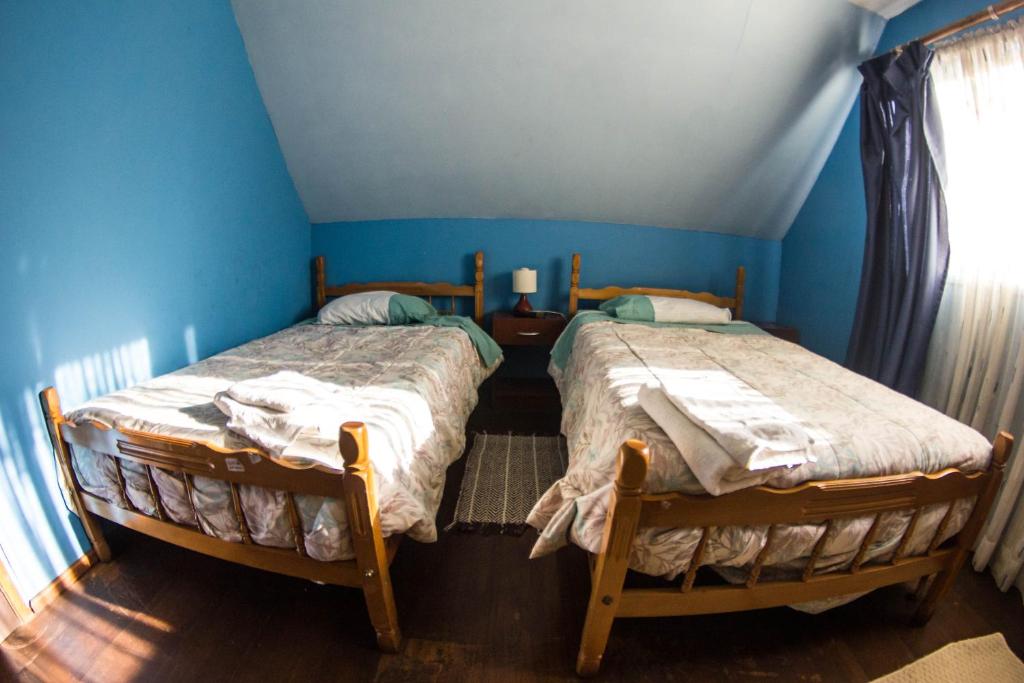Uma cama ou camas num quarto em Hostal Helios