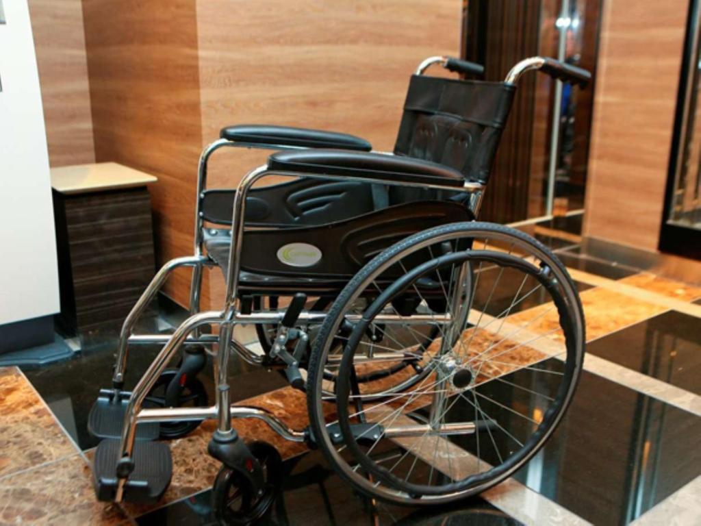 a wheelchair sitting on a counter in a room at APA Hotel Tennoji Ekimae in Osaka