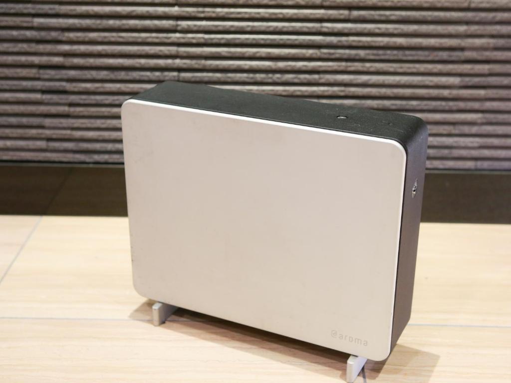 a white speaker is sitting on a floor at APA Hotel Tennoji Ekimae in Osaka