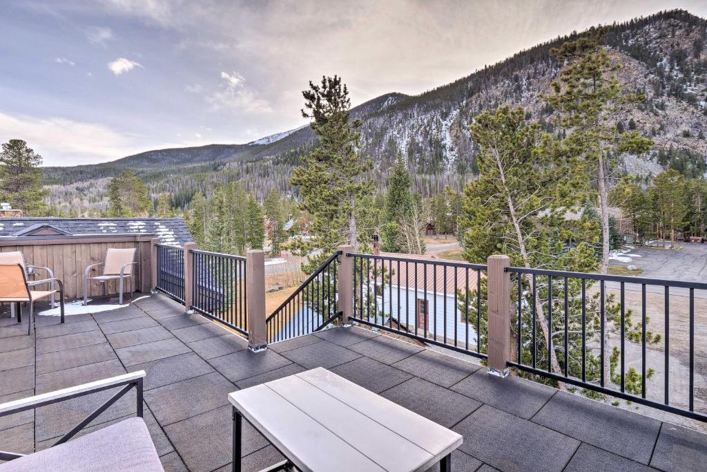 a balcony with a table and chairs and mountains at Frisco Condo with Rooftop Deck Walk to Main St! in Frisco