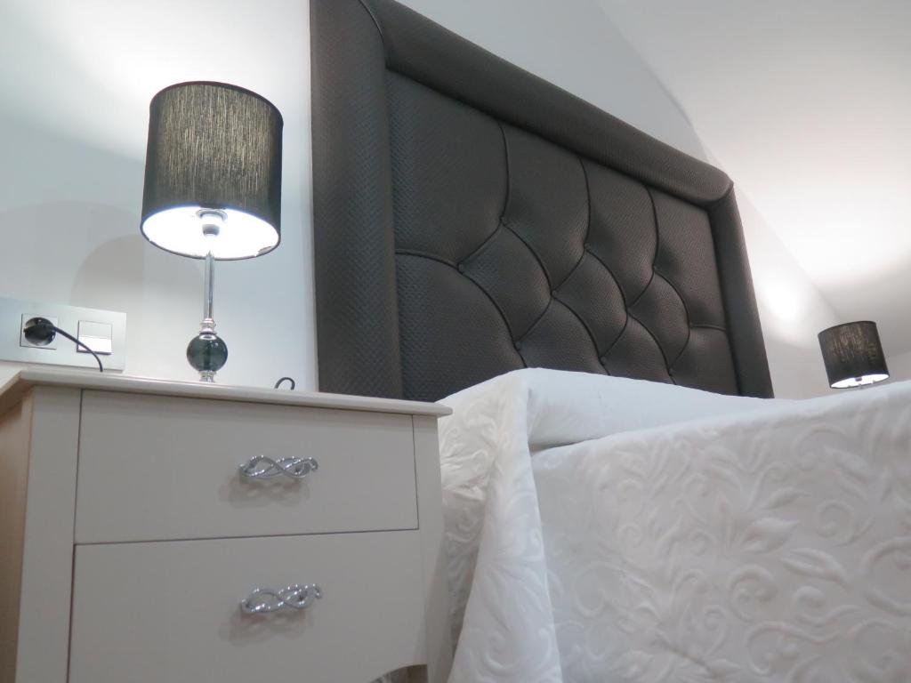 Postel nebo postele na pokoji v ubytování Hotel Restaurante Boabdil