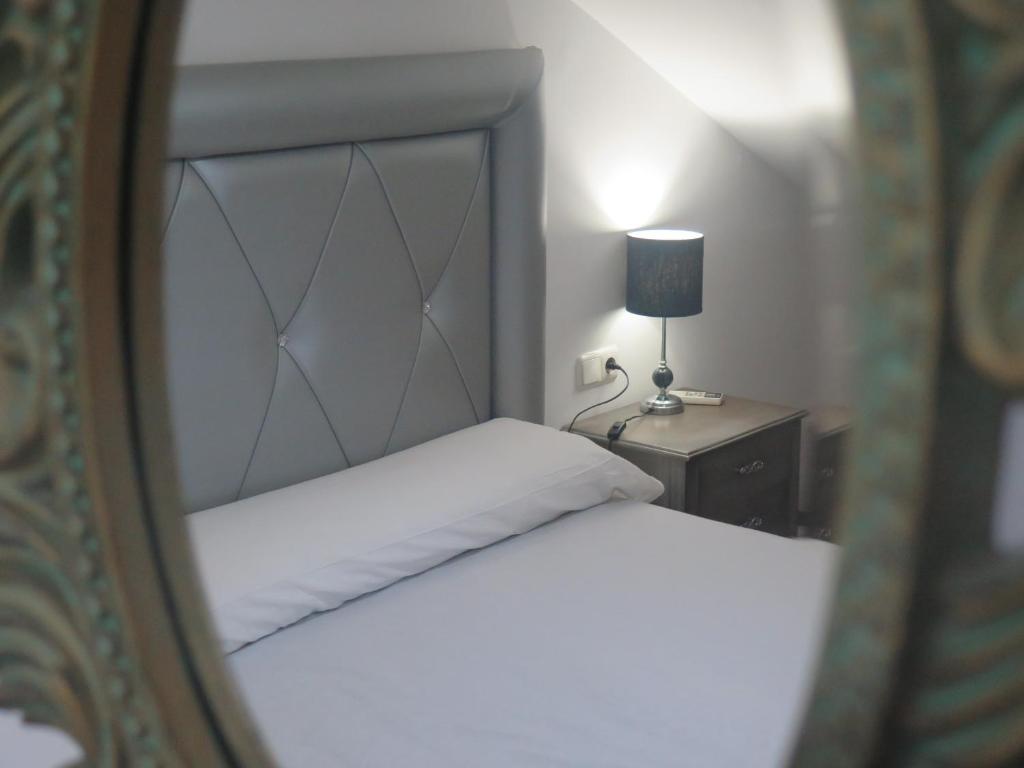 Postel nebo postele na pokoji v ubytování Hotel Restaurante Boabdil