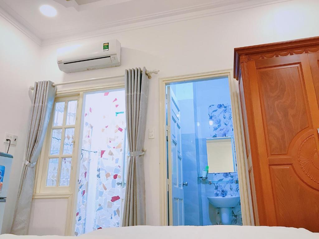 Postel nebo postele na pokoji v ubytování Hotel Khanh An
