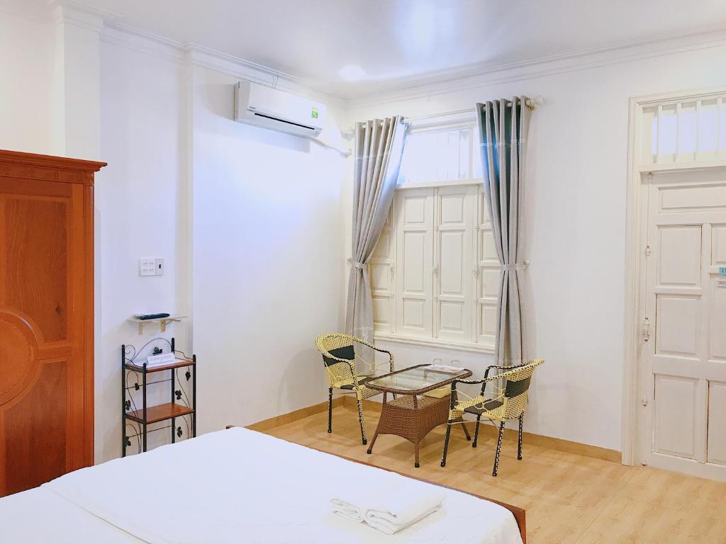 Postel nebo postele na pokoji v ubytování Hotel Khanh An