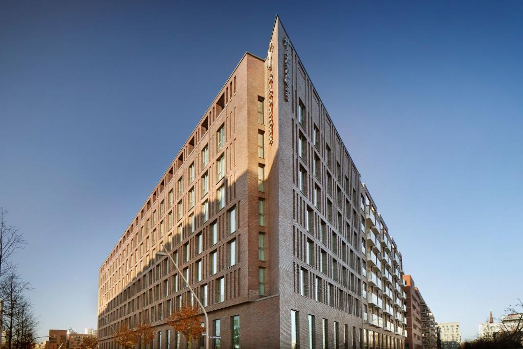 a tall brick building with a pointed roof at Holiday Inn - Hamburg - HafenCity, an IHG Hotel in Hamburg