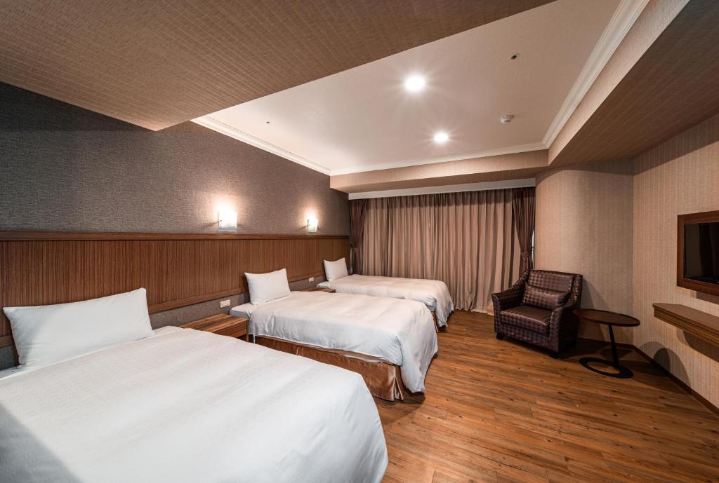 A bed or beds in a room at Fish Hotel-Pingtung