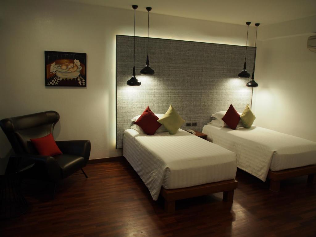 Llit o llits en una habitació de Laluna Hotel And Resort, Chiang Rai