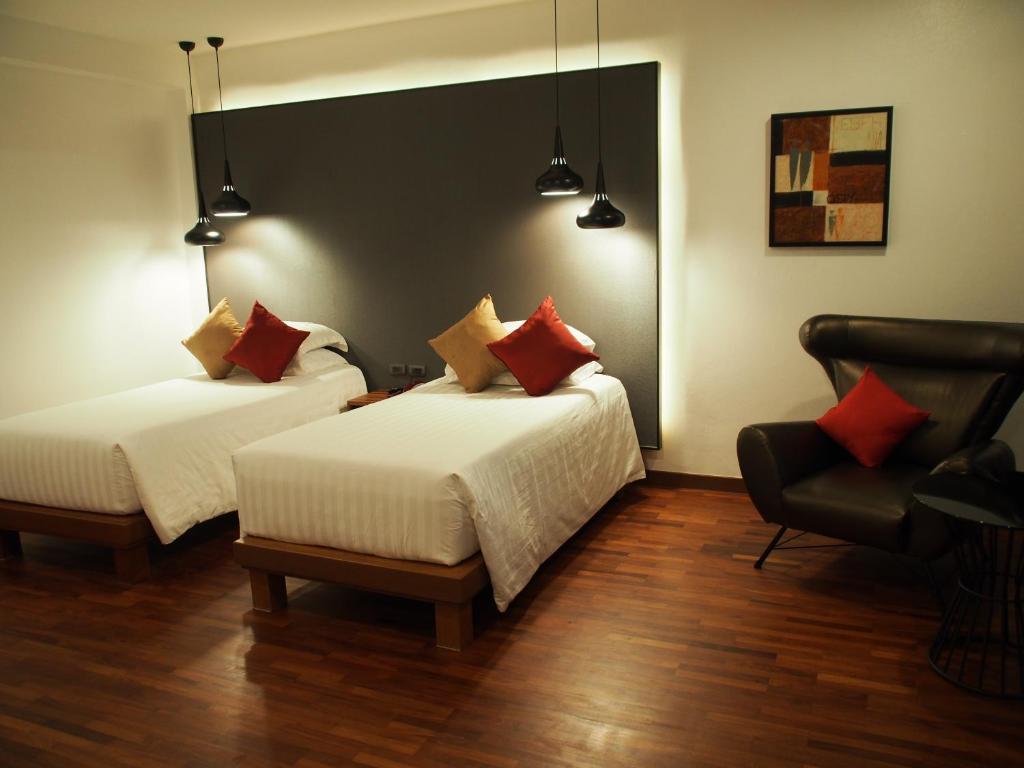 Llit o llits en una habitació de Laluna Hotel And Resort, Chiang Rai