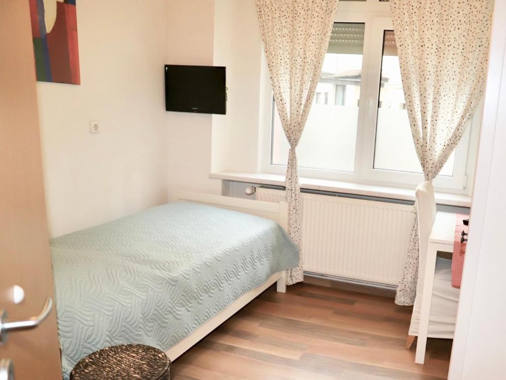 Postel nebo postele na pokoji v ubytování Hotel Aurelia