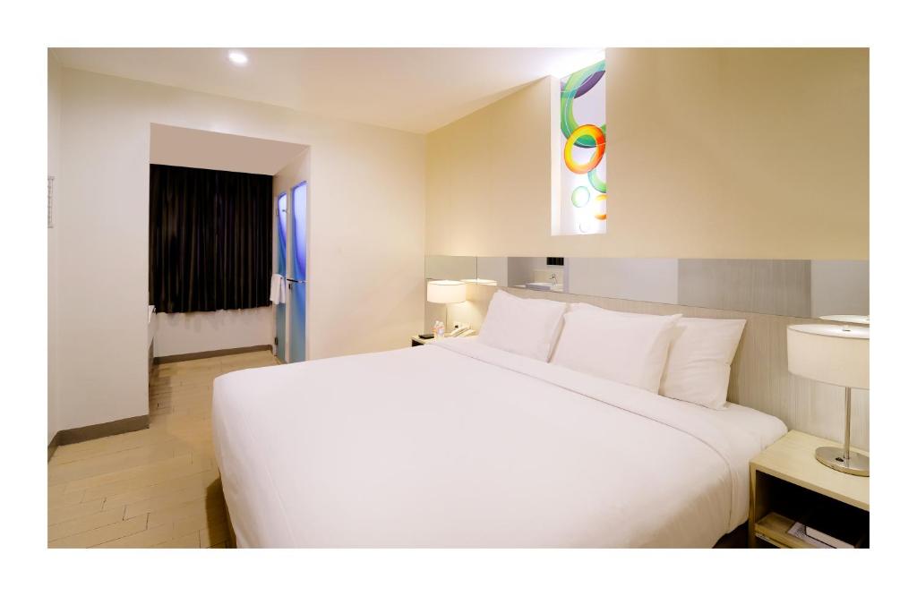 Postel nebo postele na pokoji v ubytování Go Hotels Ortigas Center