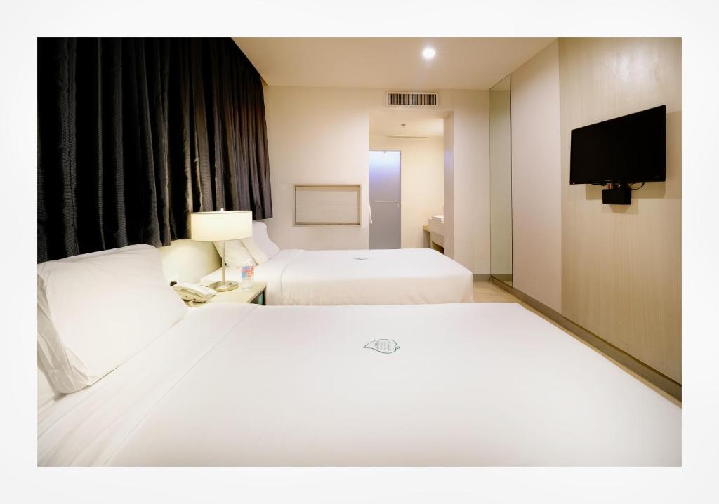 Postel nebo postele na pokoji v ubytování Go Hotels Ortigas Center