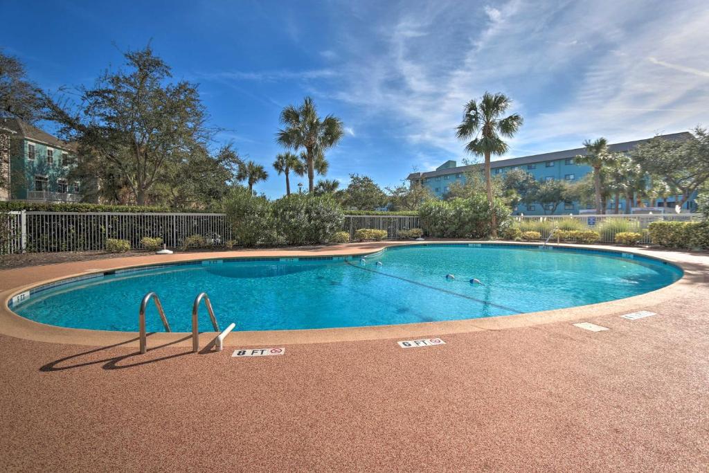 a swimming pool in the middle of a resort at Beachfront Family Condo Near Golfing and Shopping! in Hilton Head Island