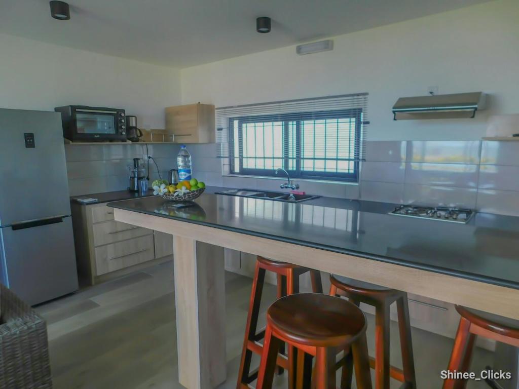 Kuchyň nebo kuchyňský kout v ubytování Fullmoon Apartment & Studio