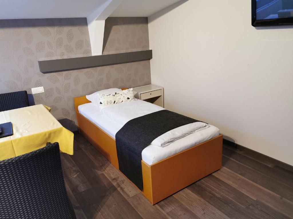 Postel nebo postele na pokoji v ubytování Hôtel Belair "Ravel Etape"
