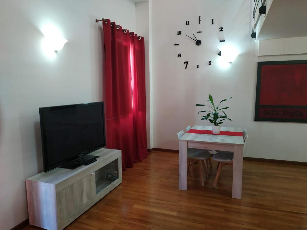 A television and/or entertainment centre at Loft VERDI Holiday Viterbo