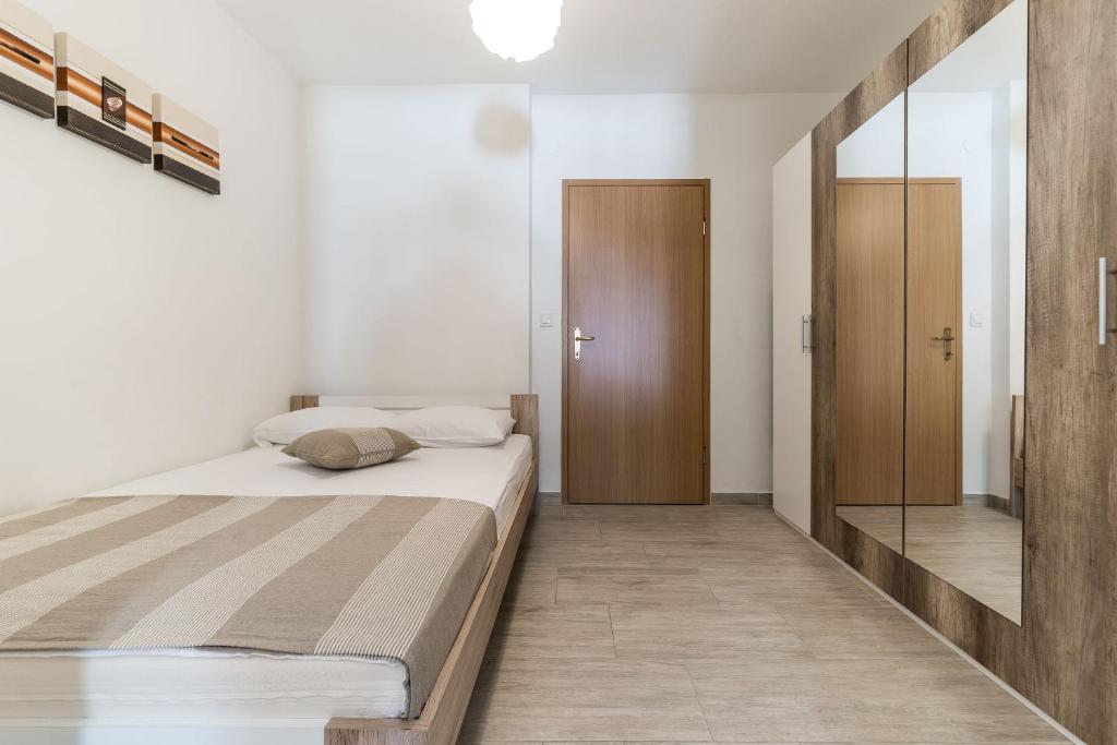 Posteľ alebo postele v izbe v ubytovaní Apartment Visic's place
