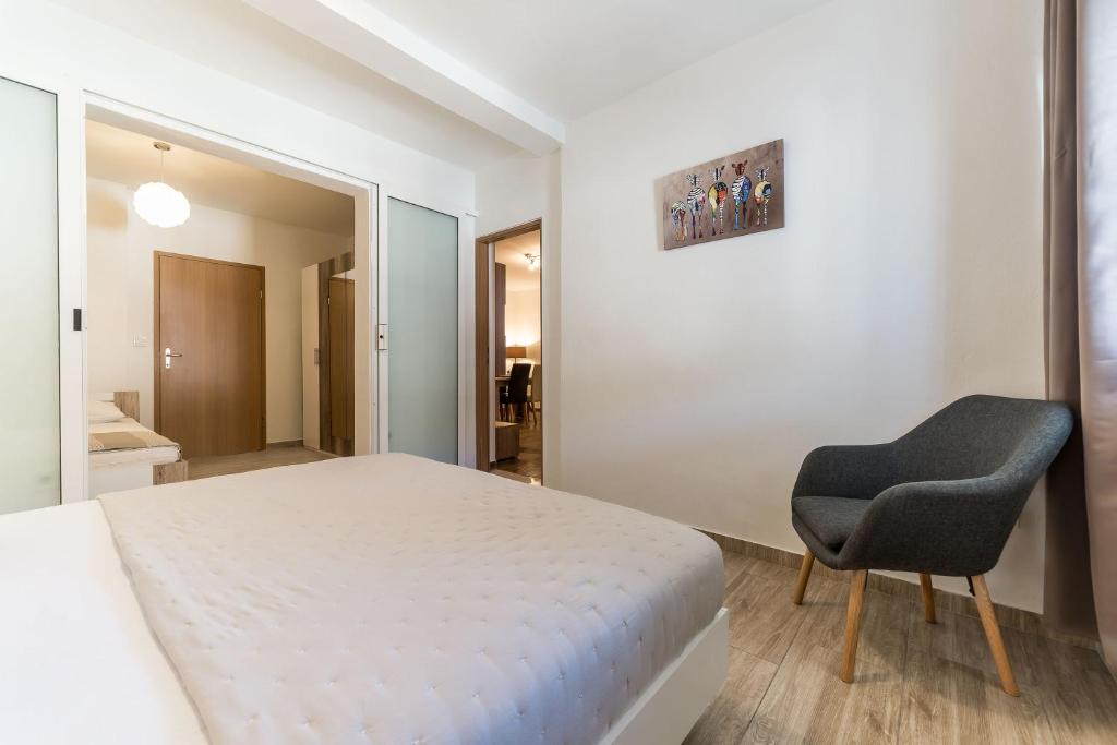 Posteľ alebo postele v izbe v ubytovaní Apartment Visic's place
