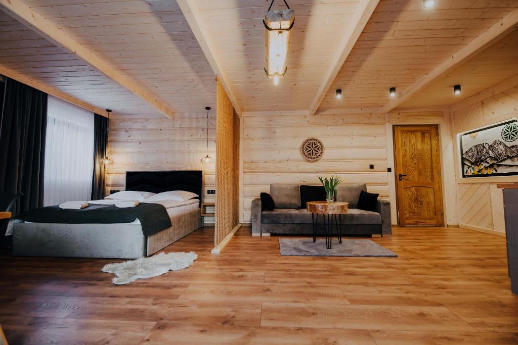 Posteľ alebo postele v izbe v ubytovaní Apartamenty Oliwia
