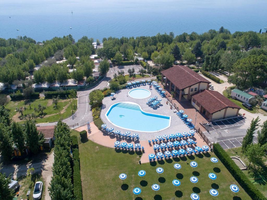 an aerial view of a resort with a swimming pool at Camping Piantelle in Moniga
