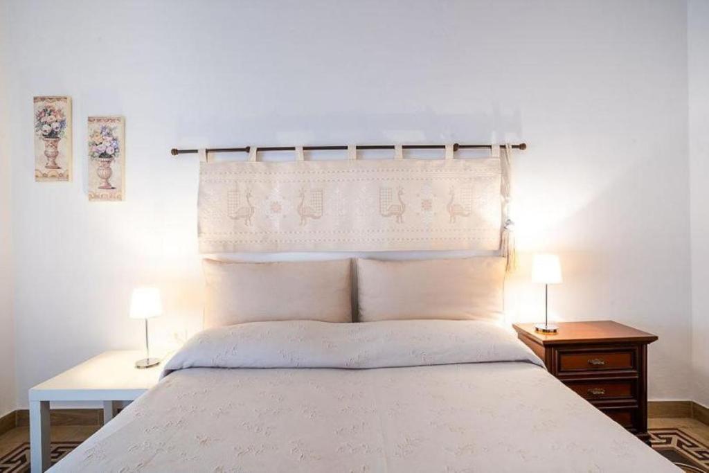 Postel nebo postele na pokoji v ubytování Holiday Home Alle Pavoncelle, indipendente con terrazzo di 60 mq