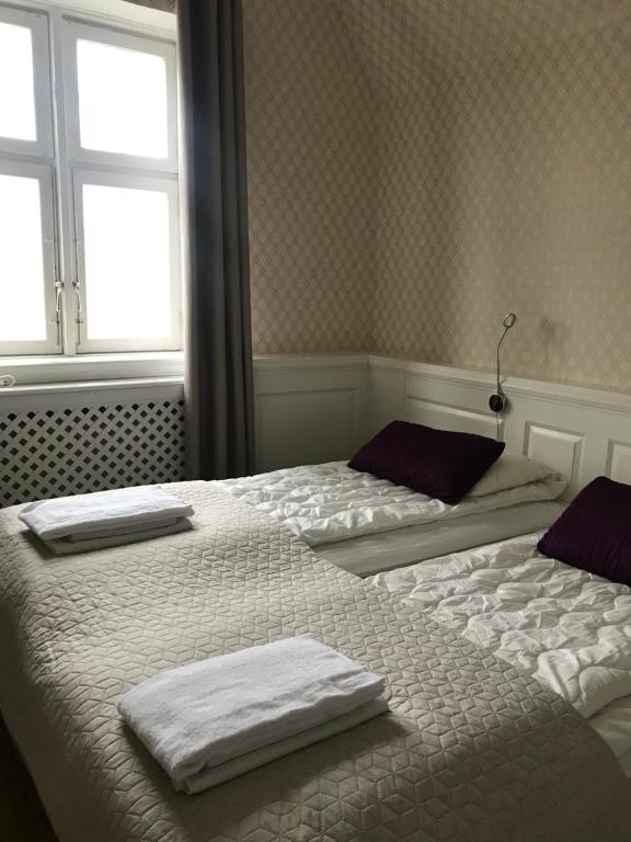 Postel nebo postele na pokoji v ubytování Halmstad Hotell & Vandrarhem Kaptenshamn
