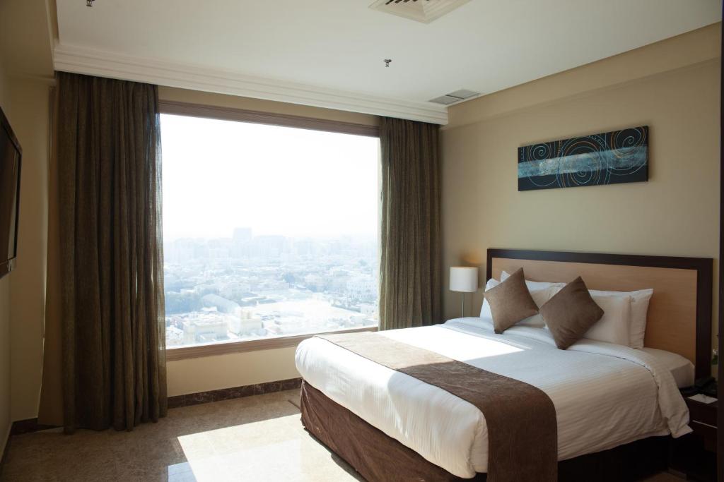 Tempat tidur dalam kamar di Best Western Plus Mahboula